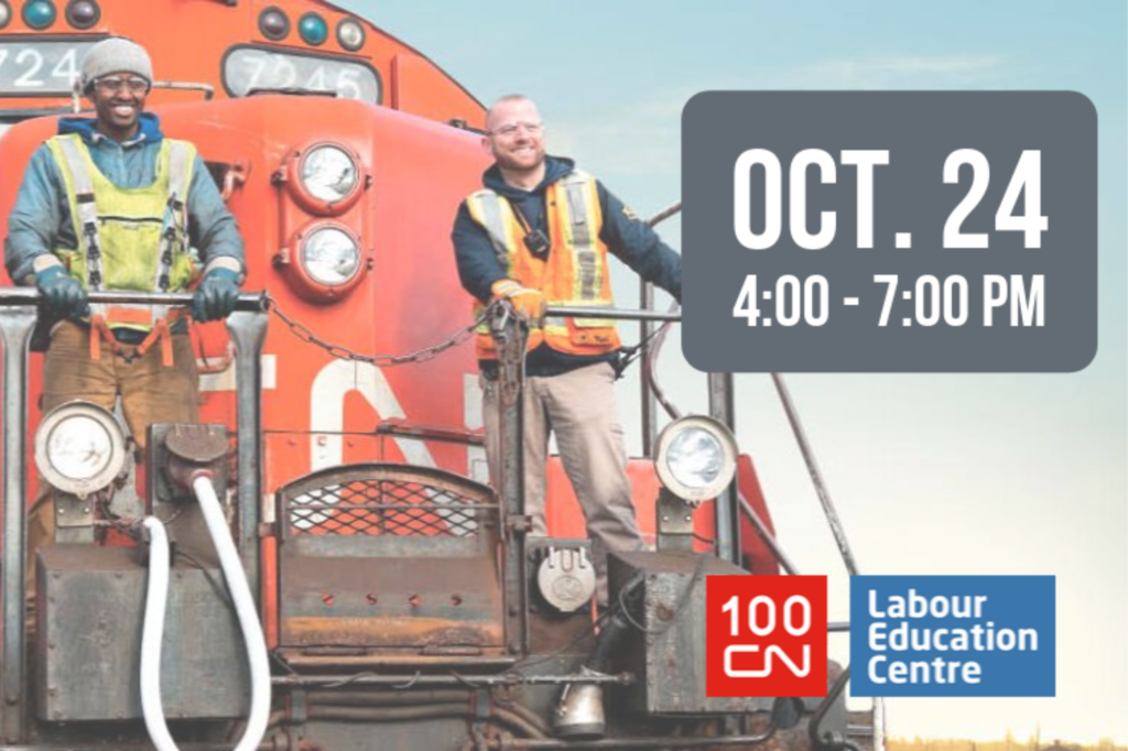 Two people standing in front of a train to promote an upcoming job fair.