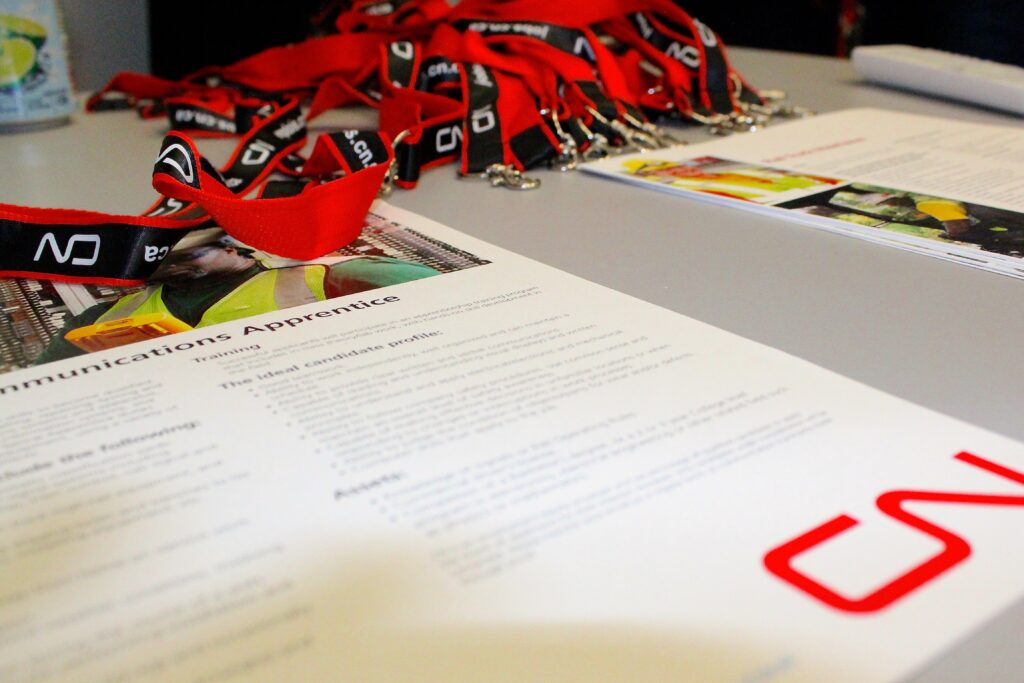 Lanyards and name tags sit on a table at the LEC job fair.