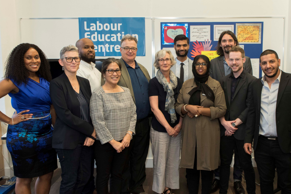 A group of LEC staff members celebrating the organization's 30th anniversary in 2018.