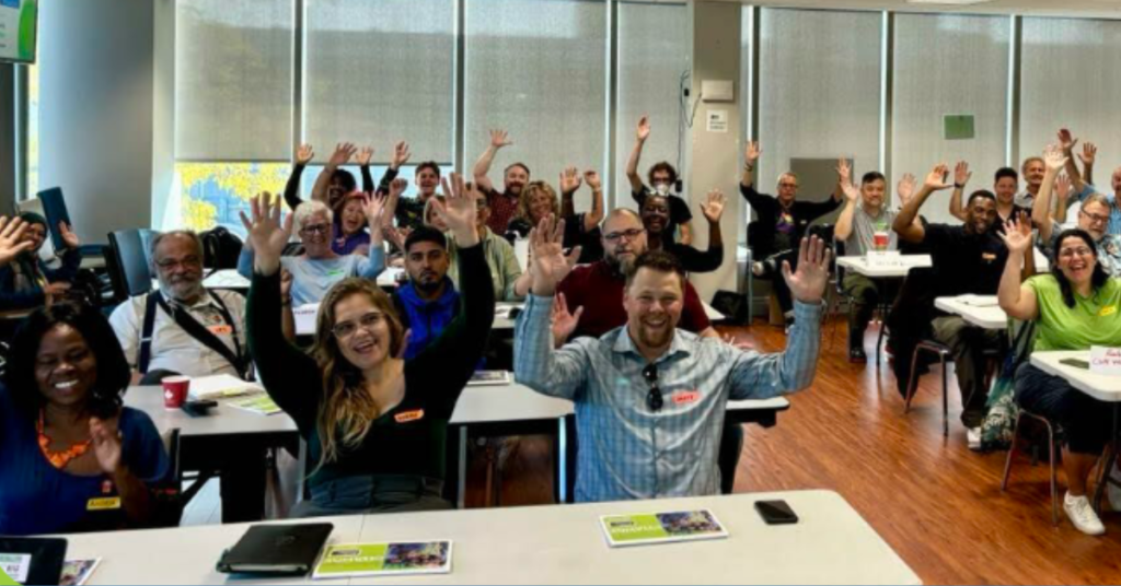 A group of happy people in a classroom